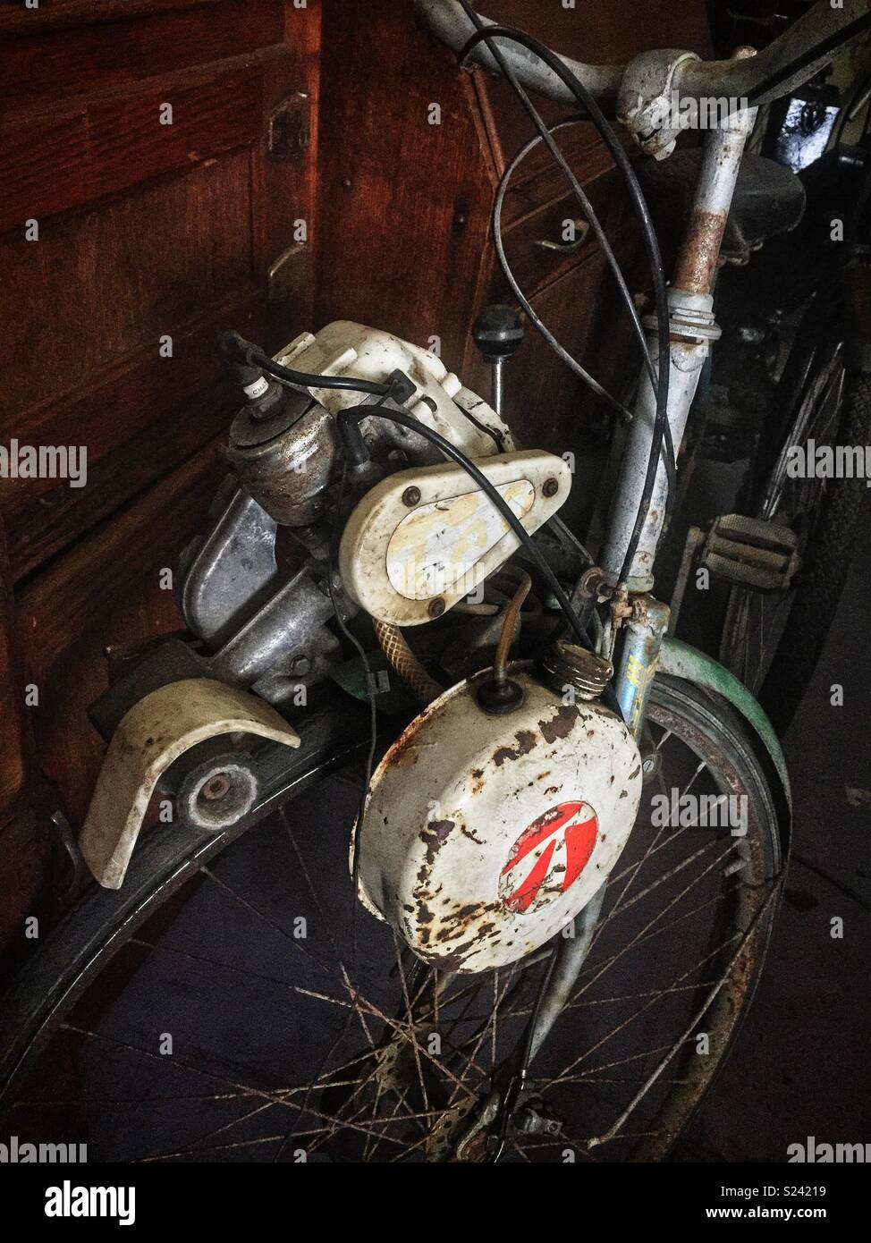 An old petrol-driven bicycle in a folk museum, Wauchope, NSW, Australia - Smartphone Captured Stock Image