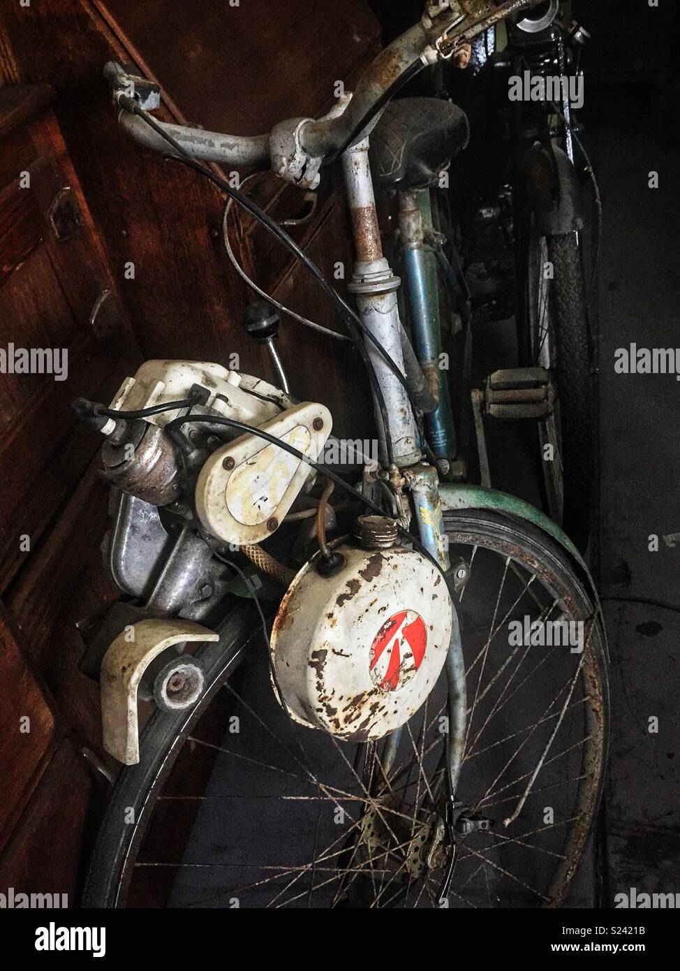 An old petrol-driven bicycle in a folk museum, Wauchope, NSW, Australia - Smartphone Captured Stock Image
