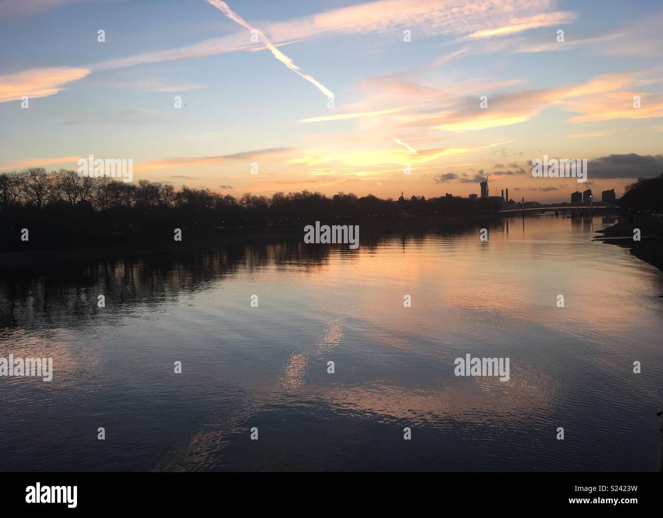 Sunset over Thames river from Chelsea Bridge Stock Photo