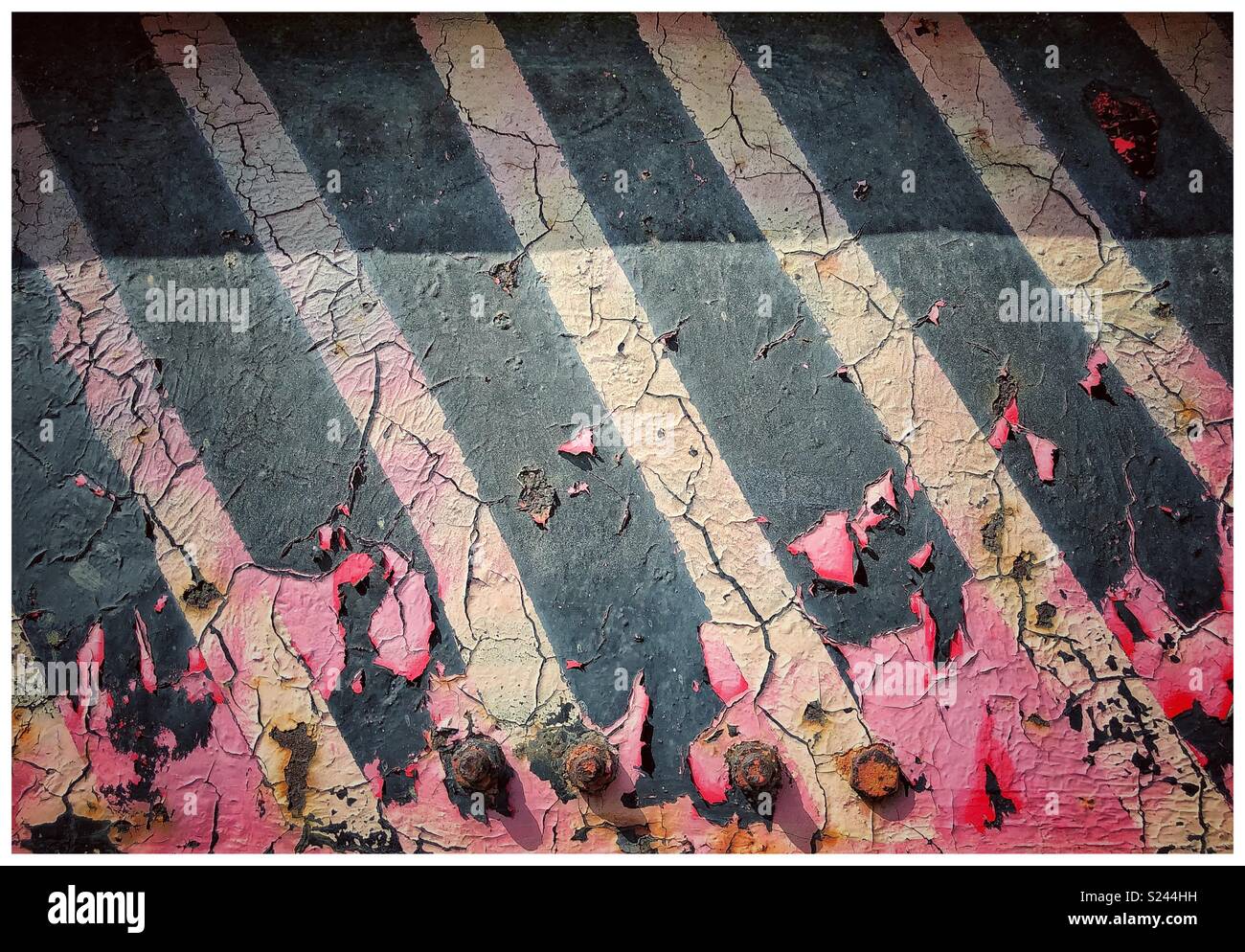 Abstract patterns - pink paint & blank & white stripes on cracked, metal surface Stock Photo