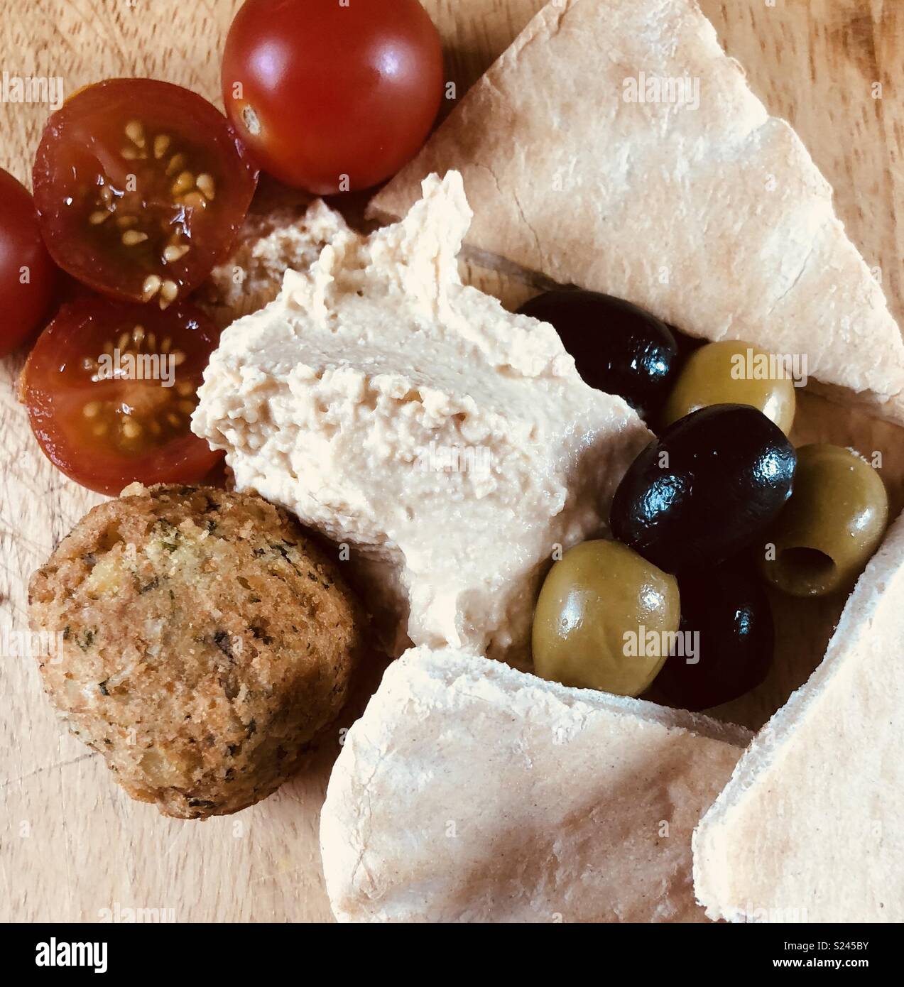 Houmous and pitta with olives and falafel Stock Photo