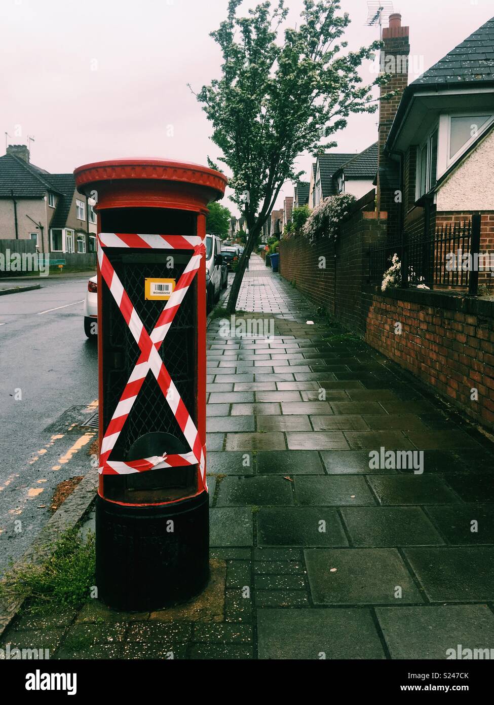 Royal Mail’s iconic red post box  out of order - Smartphone Captured Stock Image