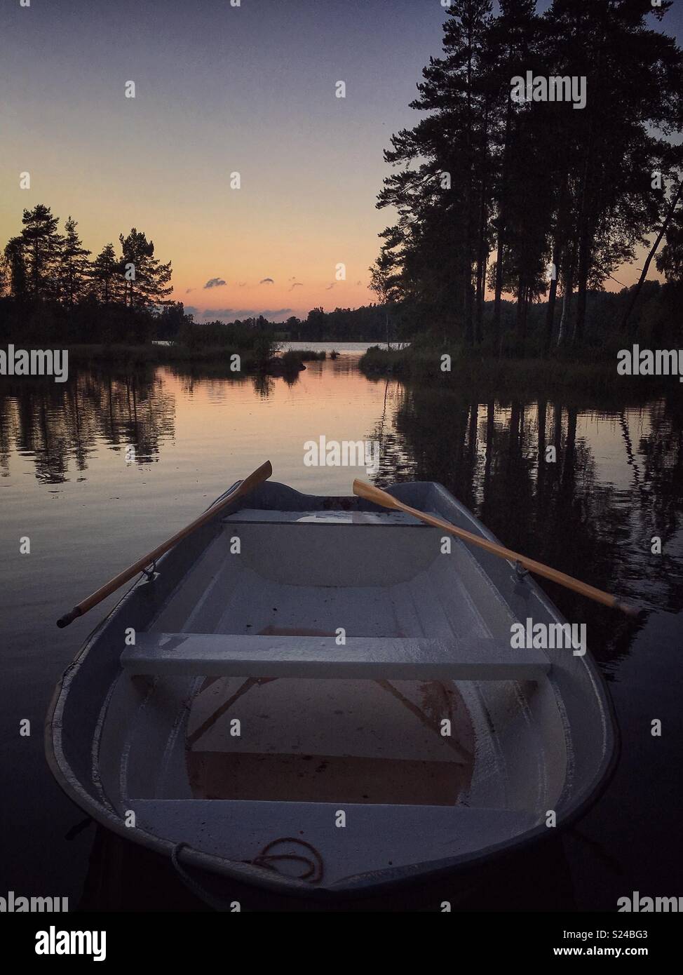 Rowing boat at sunset hires stock photography and images Alamy