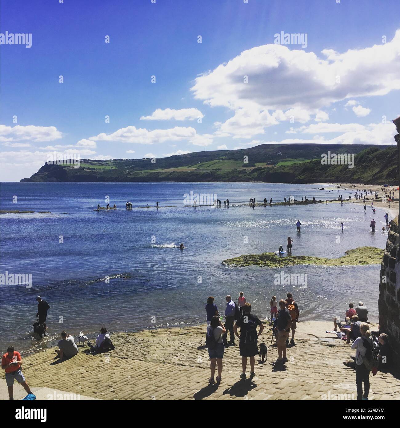 Robin Hoods Bay from causeway with tide in Stock Photo Alamy