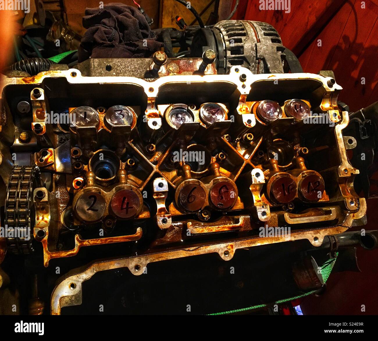 Porsche cylinder head being stripped down Stock Photo Alamy