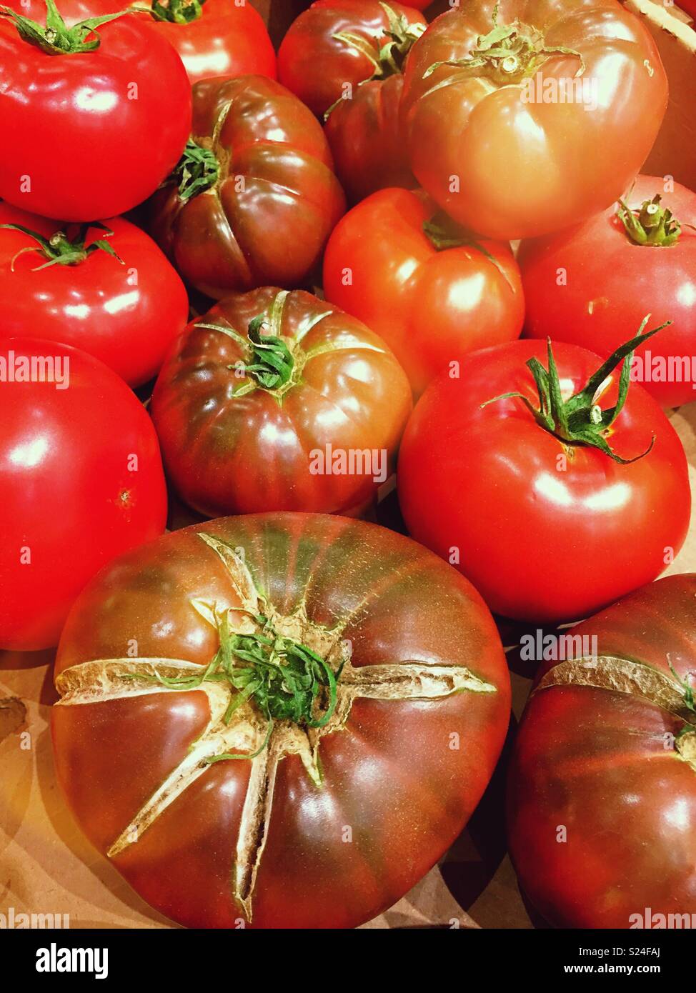 Fresh heirloom tomatoes are for sale at a farmers market, United States