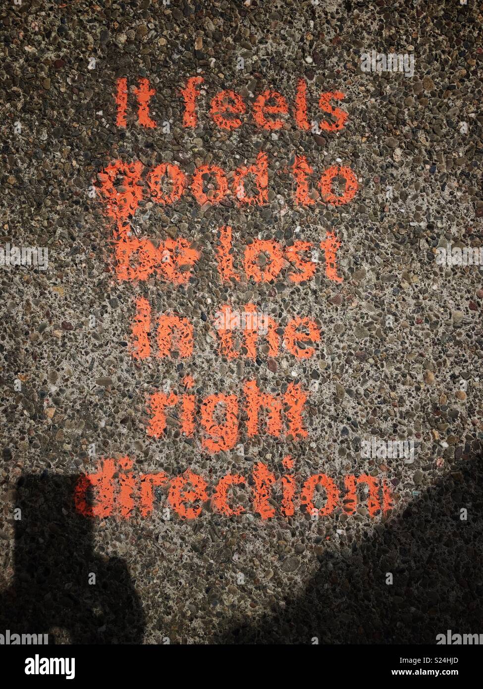 It feels good to be lost in the right direction sidewalk graffiti in Berkeley, California. Stock Photo