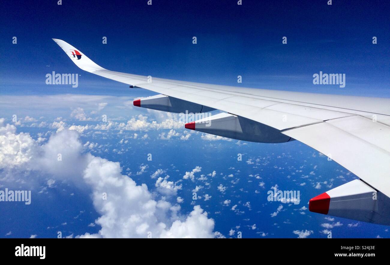 Curving Cloud under Wing - Smartphone Captured Stock Image