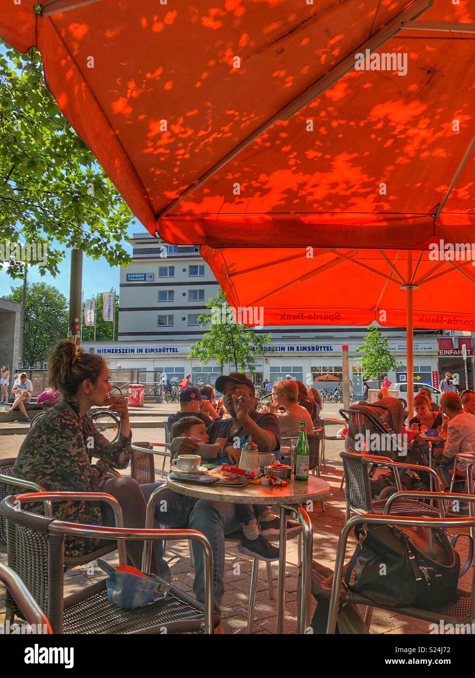 People enjoying the afternoon in a cafe in Hamburg, Germany. - Smartphone Captured Stock Image
