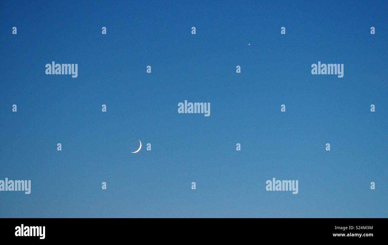 Crescent moon phase and Venus Stock Photo