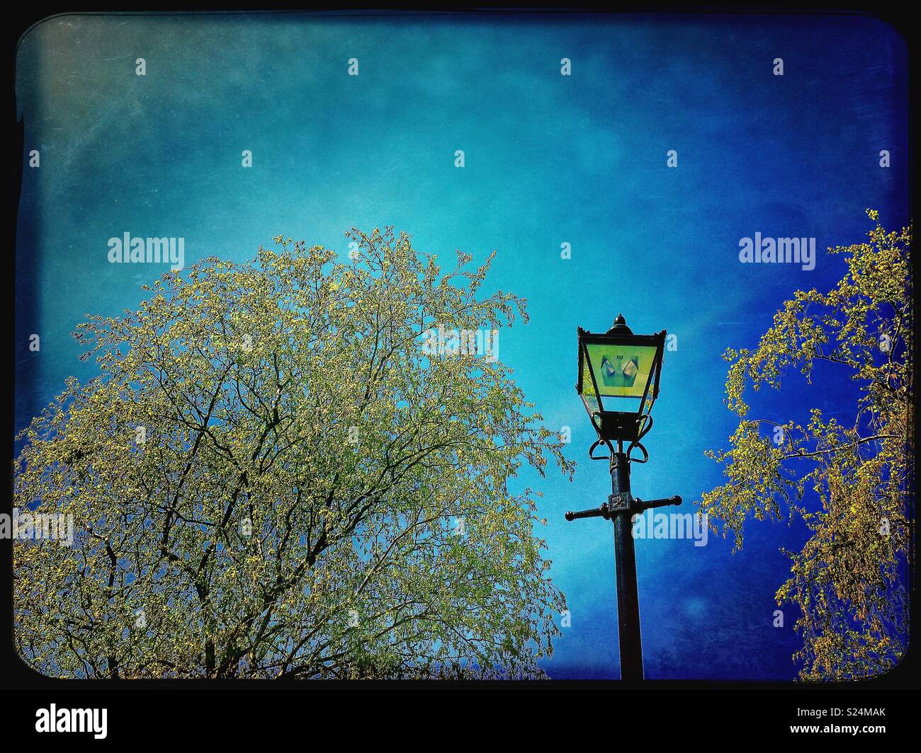 Victorian style lamppost against a deep blue sky in London - Smartphone Captured Stock Image