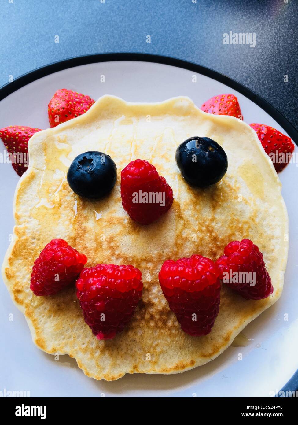 Fruity pancake face Stock Photo Alamy