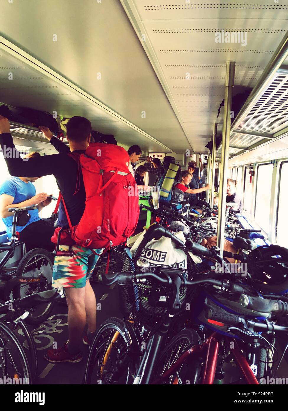 A crowded train full of bicycles and travelers on a bank holiday weekend near Berlin Stock Photo