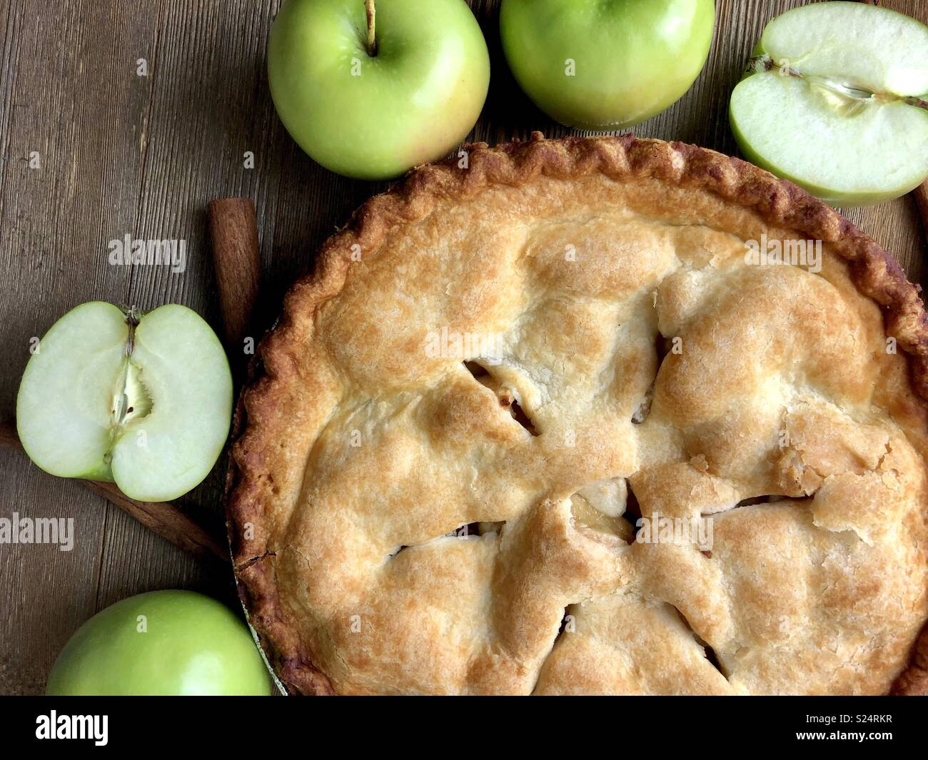Apple pie on a rustic wood surface - Smartphone Captured Stock Image