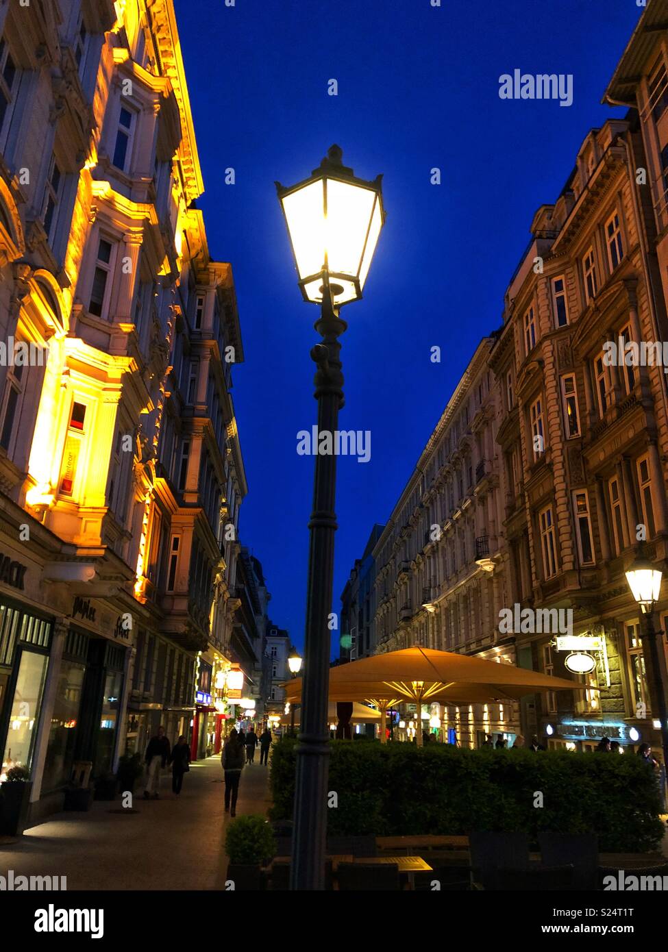 A lit pedestrian zone in Hamburg, Germany. - Smartphone Captured Stock Image