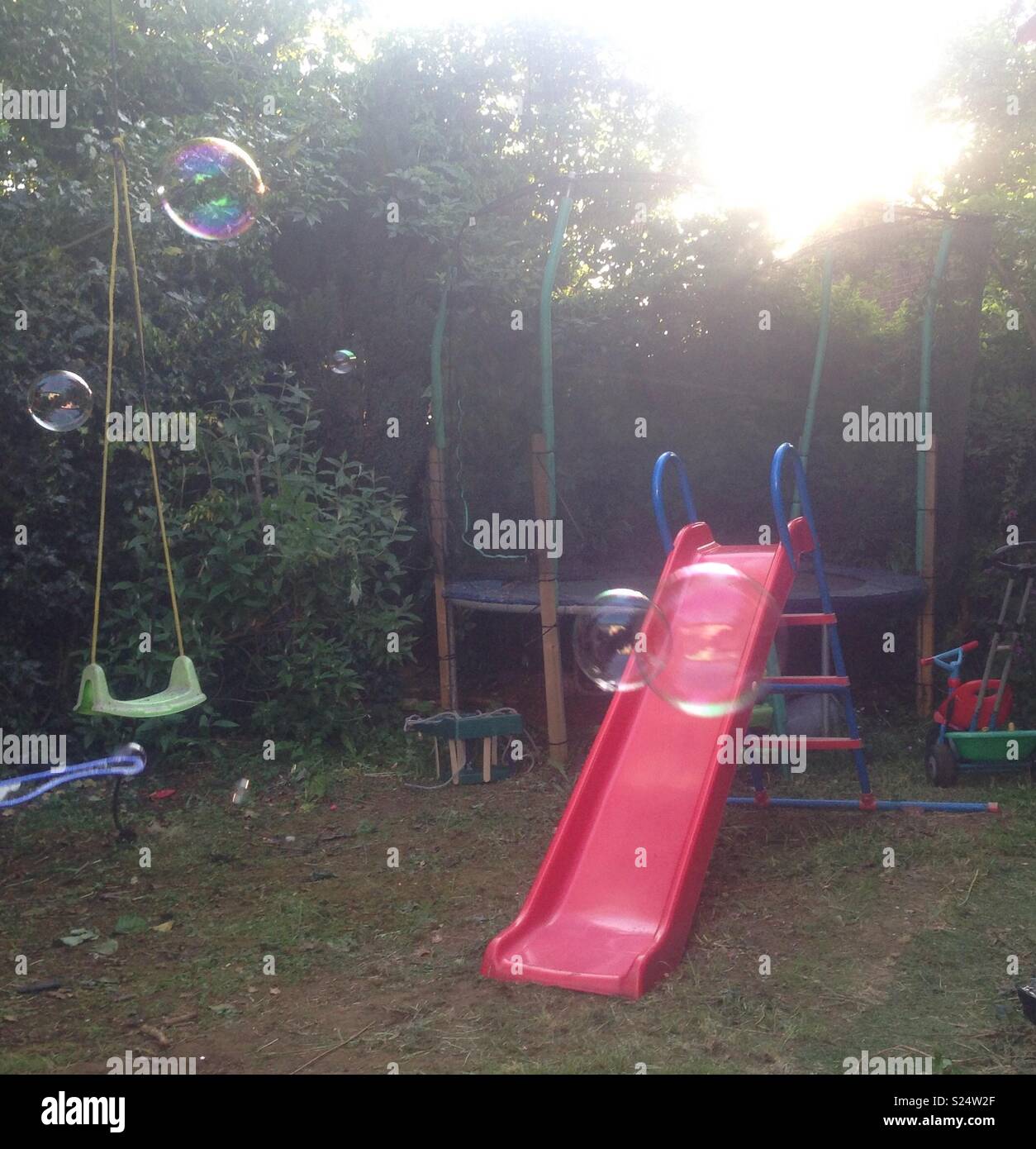 trampoline with slide and swing
