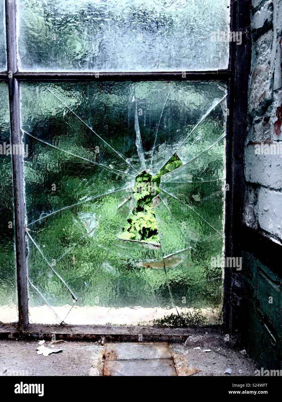 Picture of broken pane taken from inside a mill in West Yorkshire taken in 2017 Stock Photo