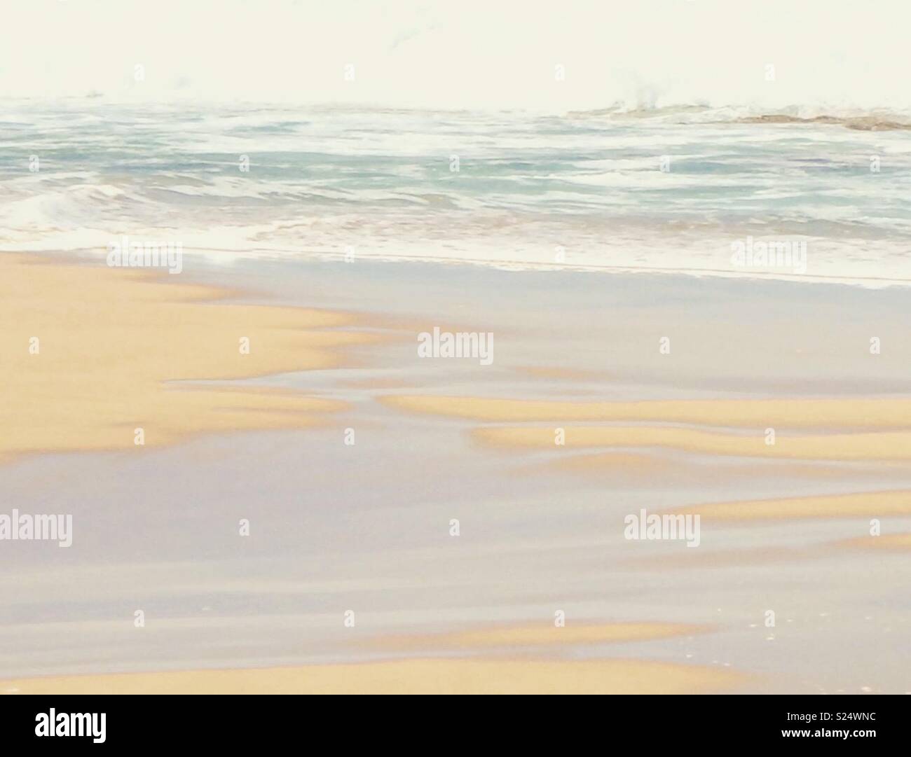 Muted waves on the shore. Stock Photo