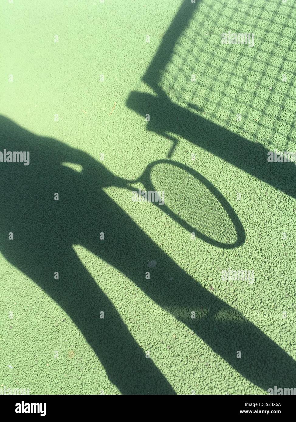 Shadow of tennis player Stock Photo