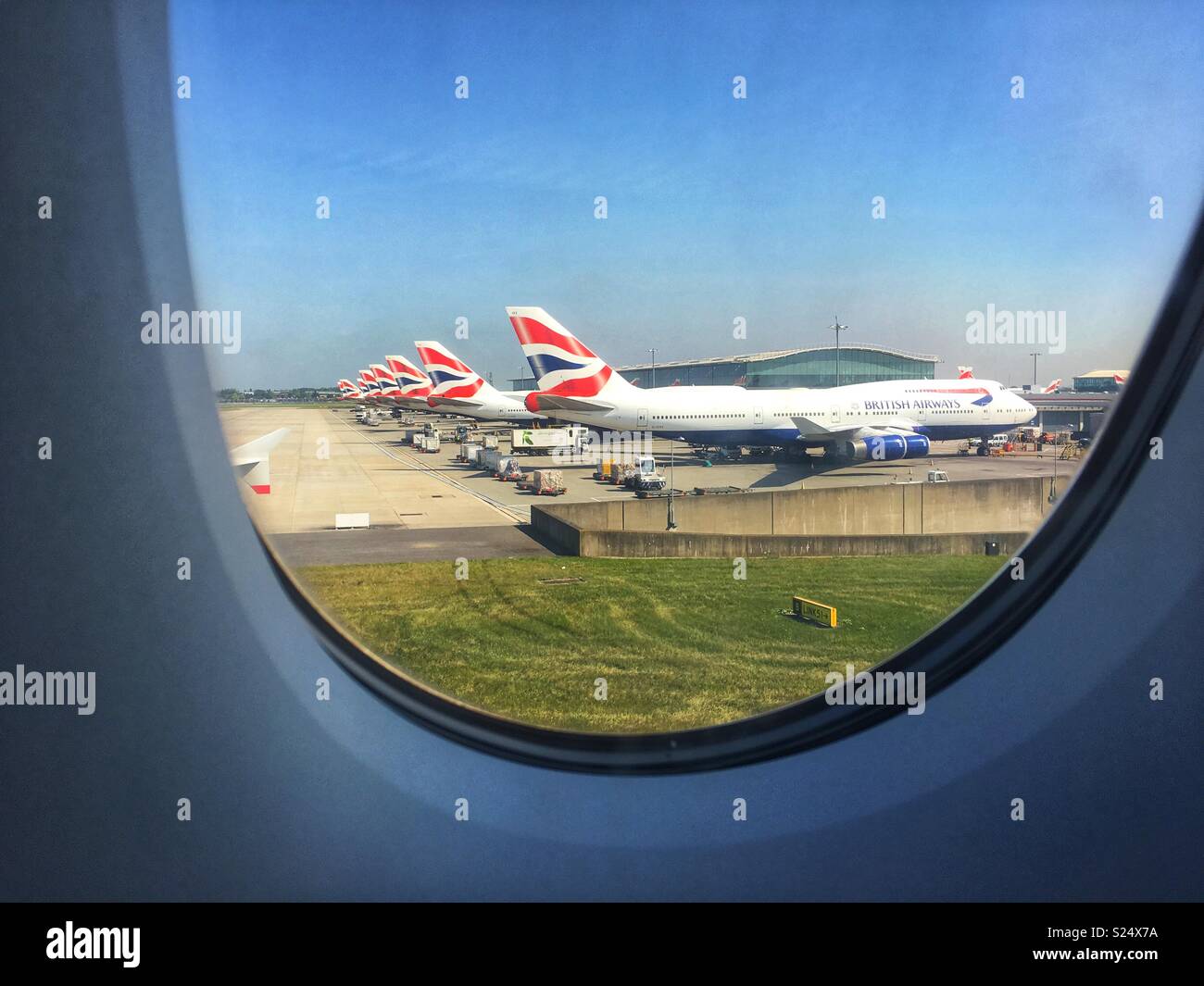 A row of British Airways airplanes at Heathrow Airport, London, England UK Stock Photo