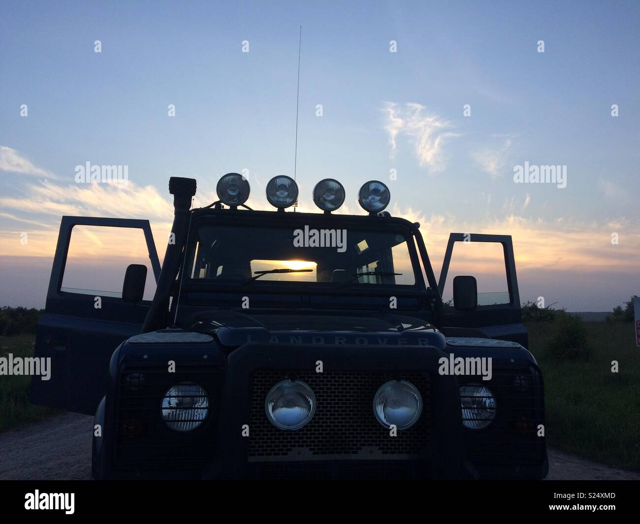 Land Rover at sunset Stock Photo Alamy