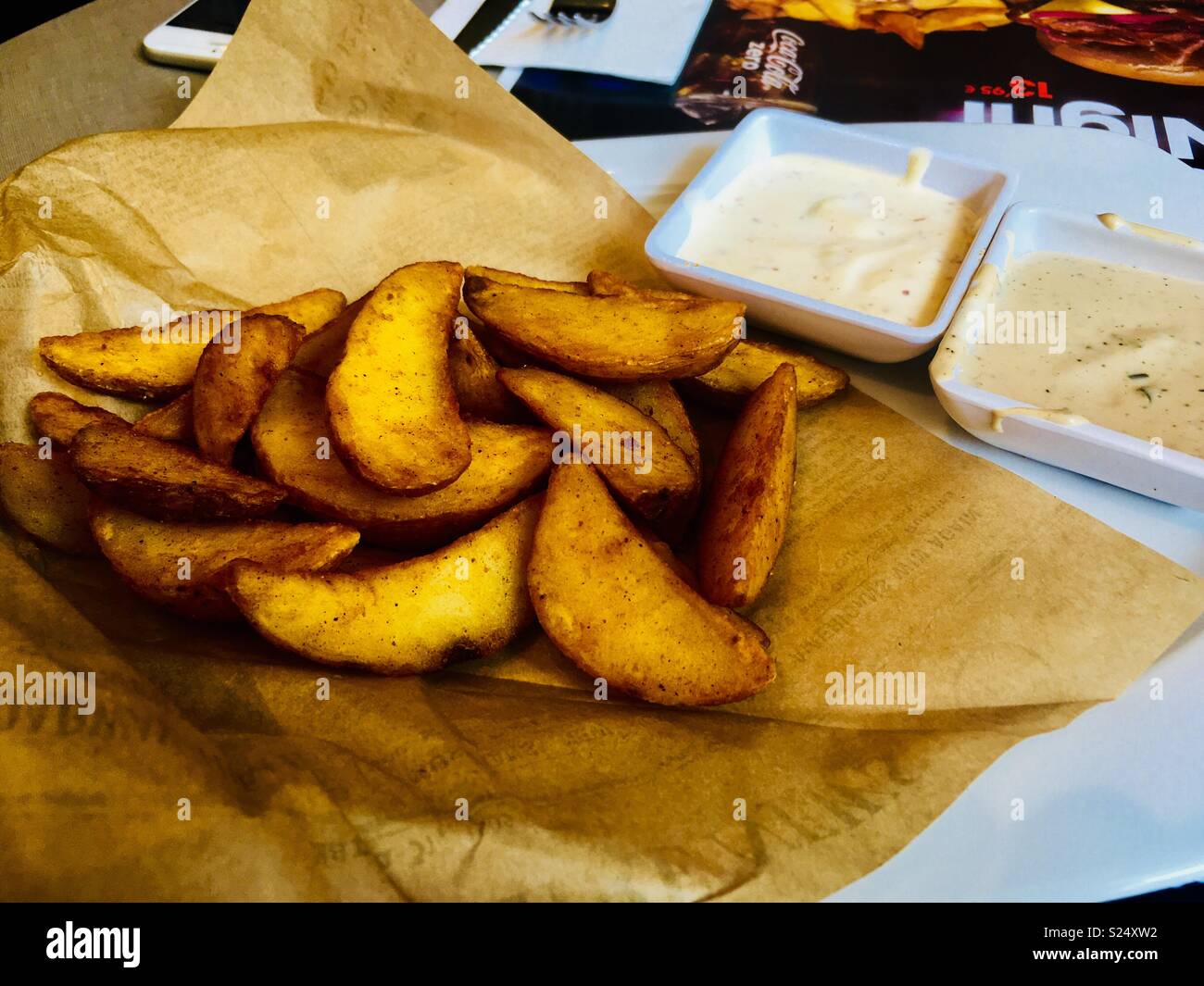 French fries with sauces in Madrid - Smartphone Captured Stock Image