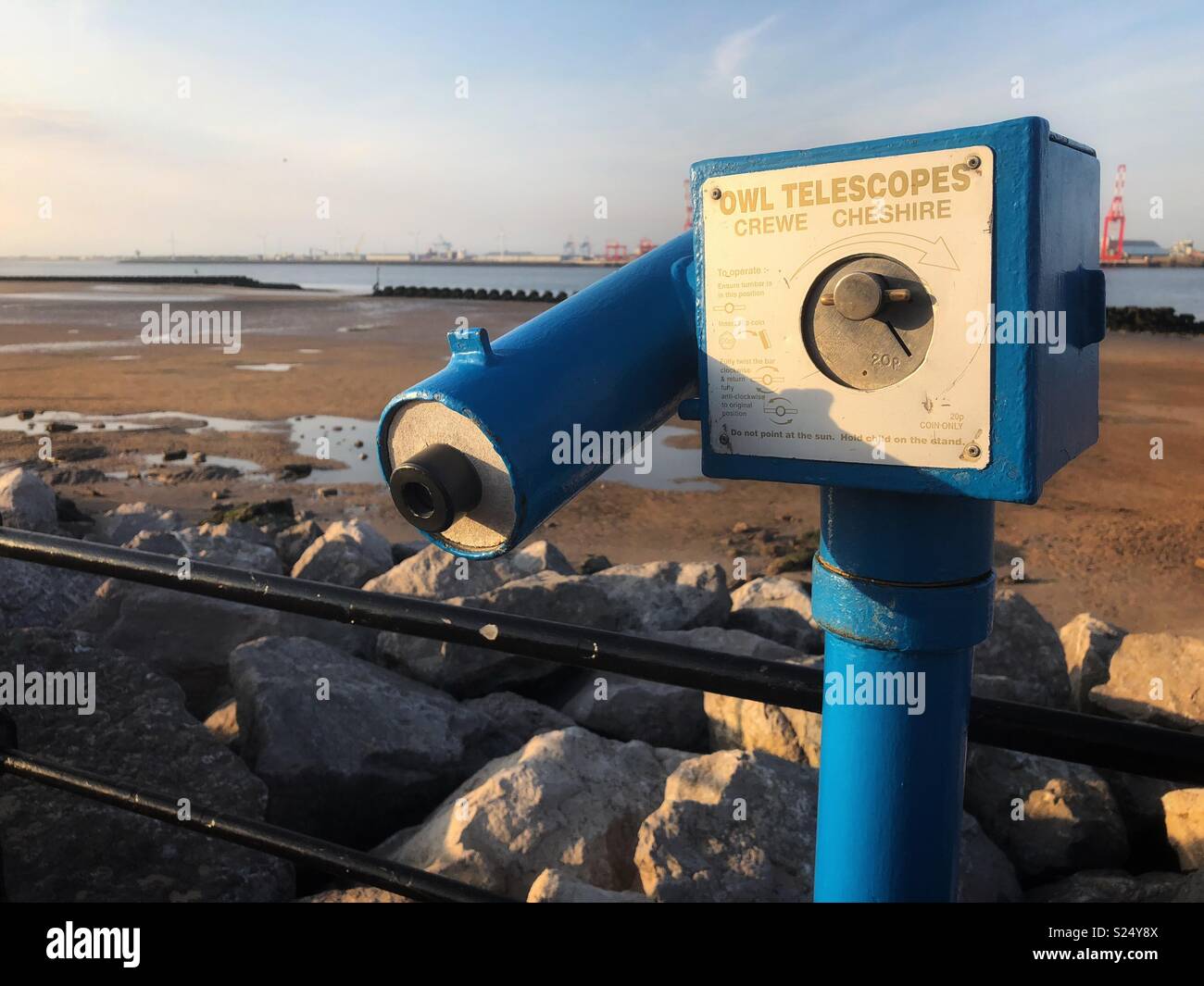 A blue coin-operated telescope at the seaside, New Brighton, Wirral Stock Photo