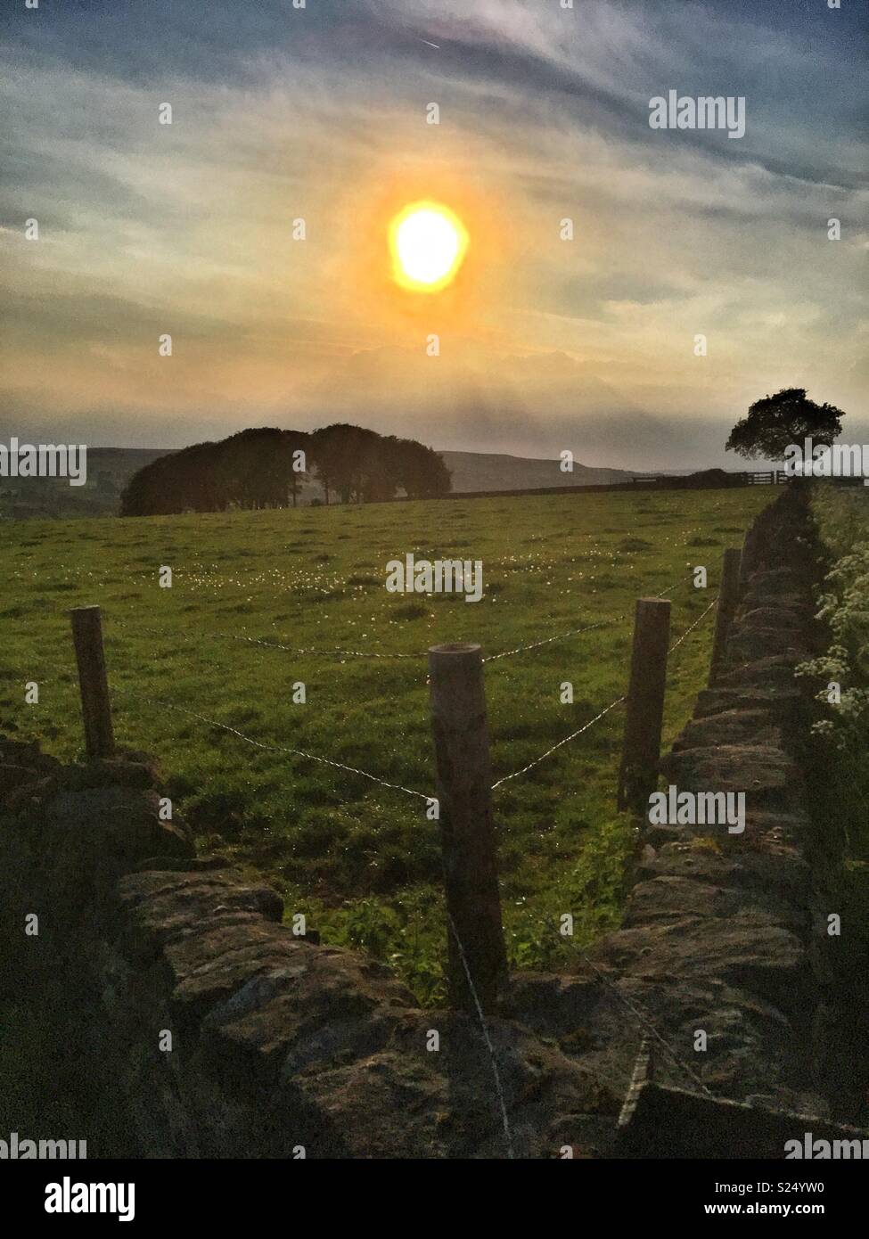 The evening sun over Ilkley Moor seen from Guiseley West Yorkshire - Smartphone Captured Stock Image