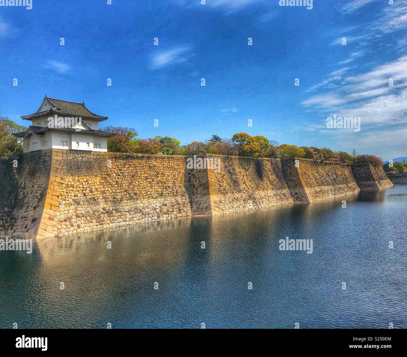 Moat and stone wall around Osaka Castle, Japan. - Smartphone Captured Stock Image
