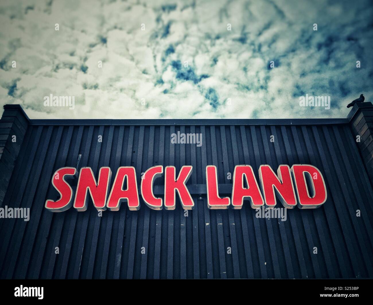 “Snack Land” sign in a corner convenience store, Vancouver, British Colombia, Canada. - Smartphone Captured Stock Image