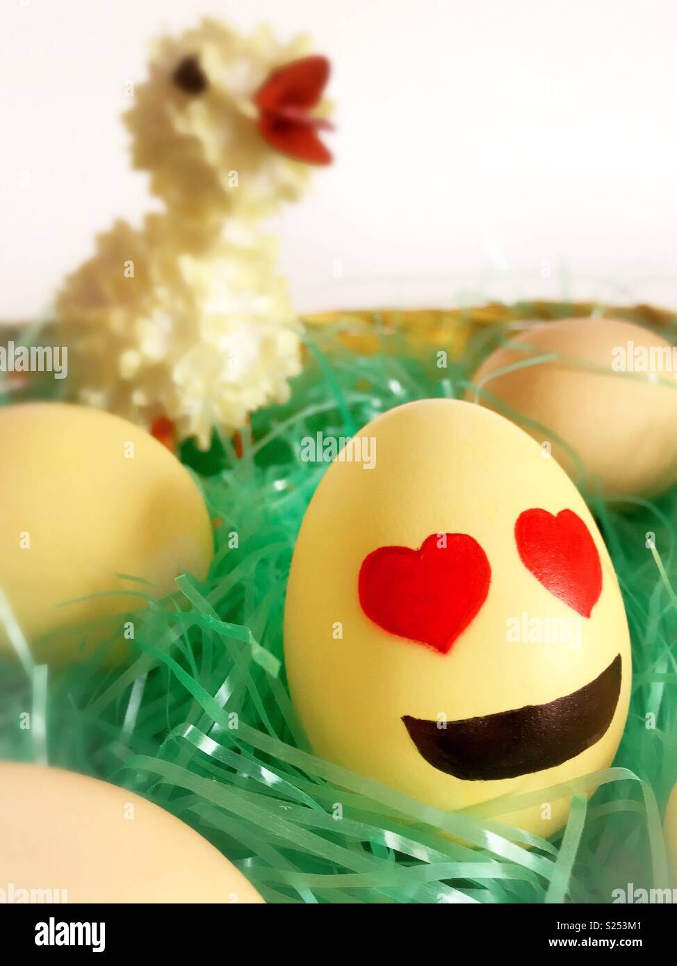 Still life of Easter decorative pieces, cute duckling and love emoji, United States - Smartphone Captured Stock Image