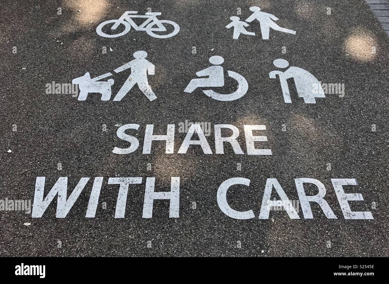 Safety message on a multi-purpose path through a public park - Smartphone Captured Stock Image