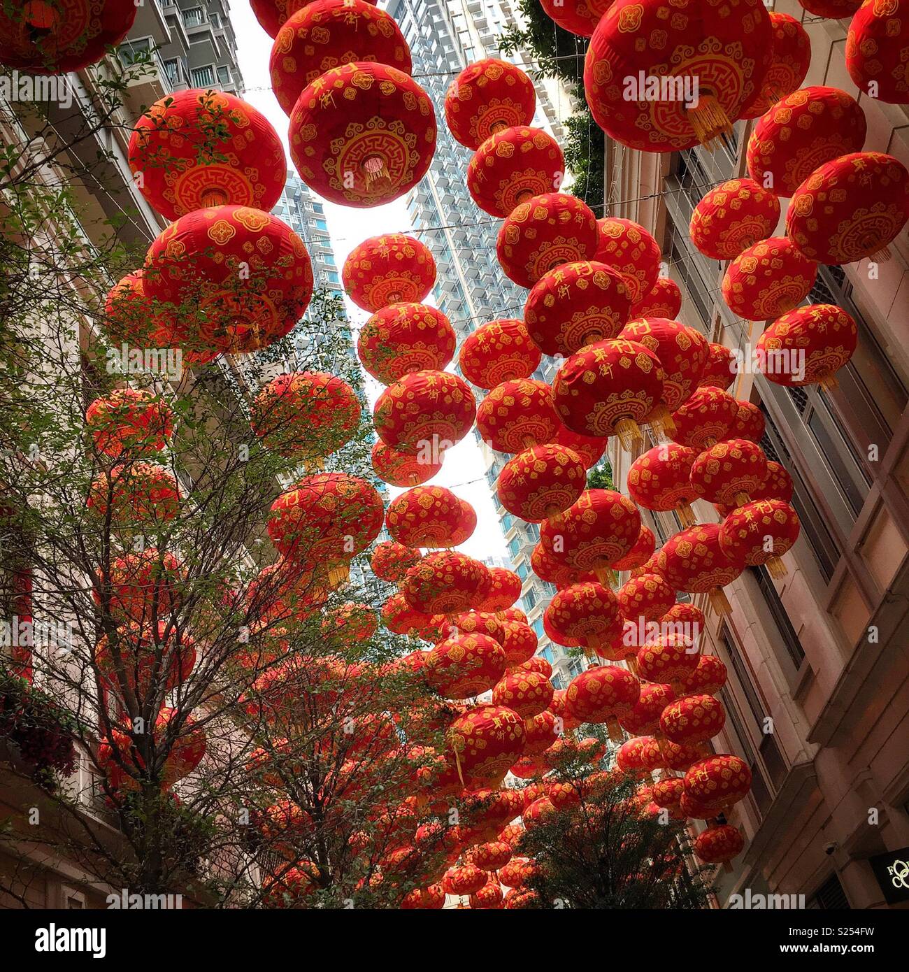 Red lanterns, traditional decorations for Chinese New Year, in Lee Tung Avenue, a shopping mall opened in 2015 on the site of old Lee Tung Street (‘Wedding Card Street’) in Wan Chai, Hong Kong - Smartphone Captured Stock Image