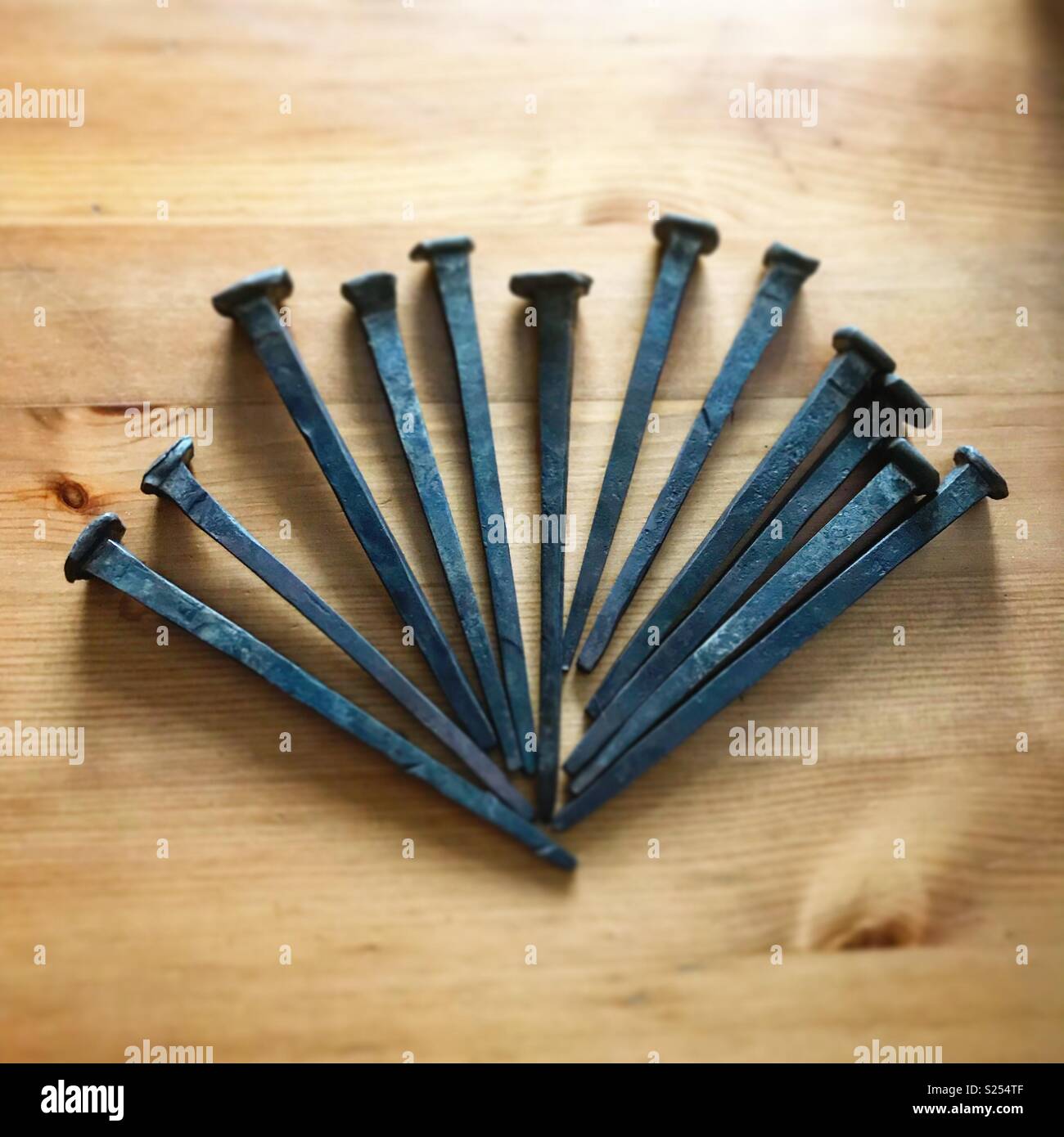 Bespoke handmade iron nails Stock Photo Alamy