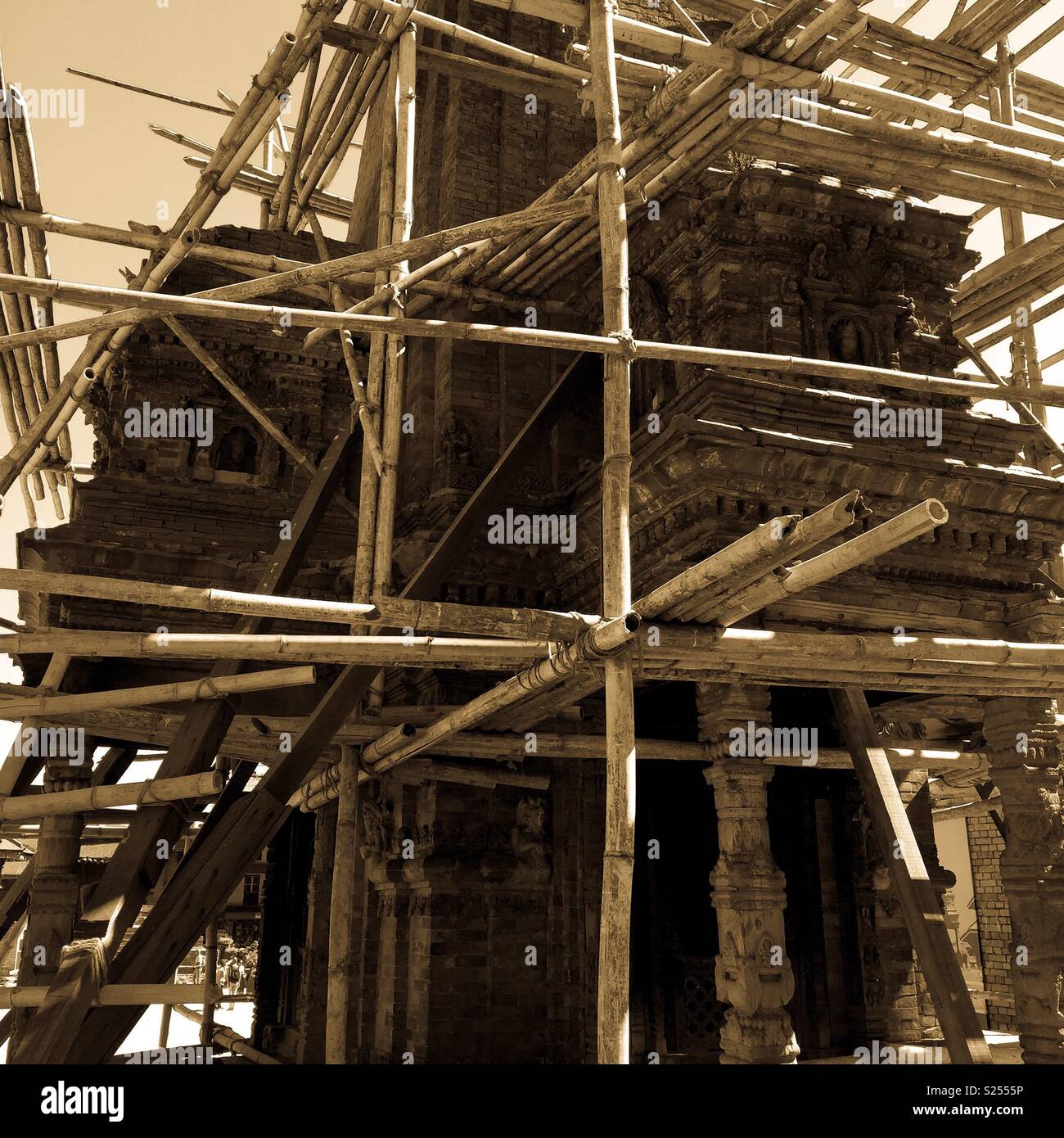Earthquake damaged temple covered in wooden scaffolding, Durbar Square,Bhaktapur, Nepal - Smartphone Captured Stock Image