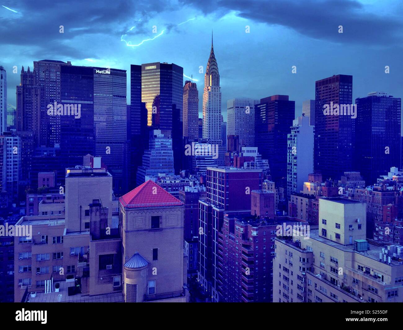 View of midtown Manhattan from a high-rise apartment building in Murray Hill at night, NYC, USA - Smartphone Captured Stock Image