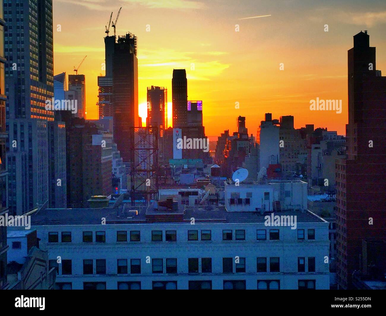 Sunset skyline view of midtown Manhattan including Hudson yards under construction, NYC, USA - Smartphone Captured Stock Image