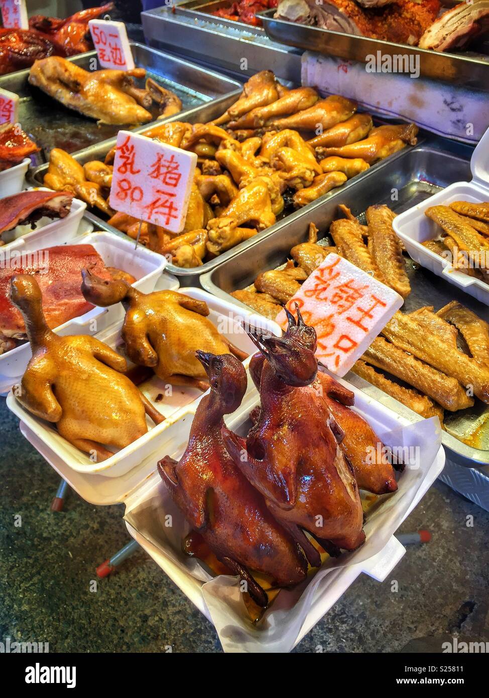 Traditional Cantonese barbequed meats and poultry, or Siu Mei, for sale in a food market, Yuen Long, New Territories, Hong Kong Stock Photo