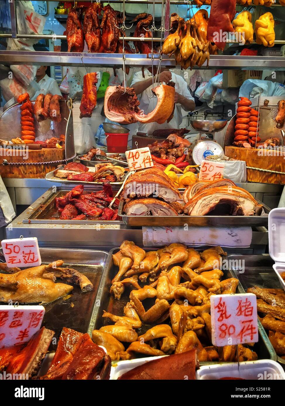 Traditional Cantonese barbequed meats and poultry, or Siu Mei, for sale in a food market, Yuen Long, New Territories, Hong Kong Stock Photo