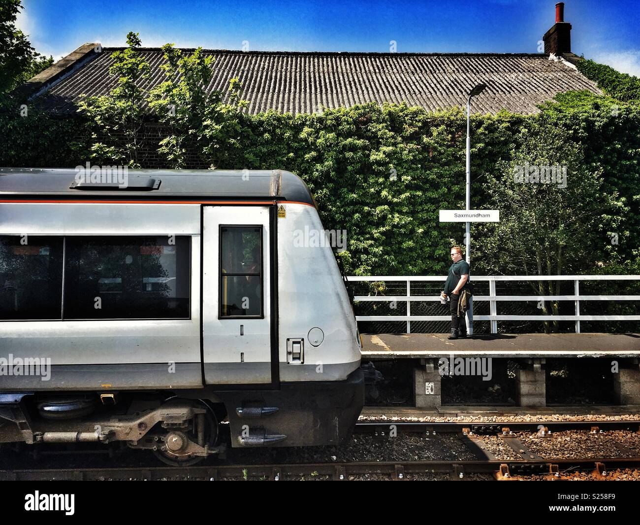 Rail passenger, Saxmundham, Suffolk, England. - Smartphone Captured Stock Image