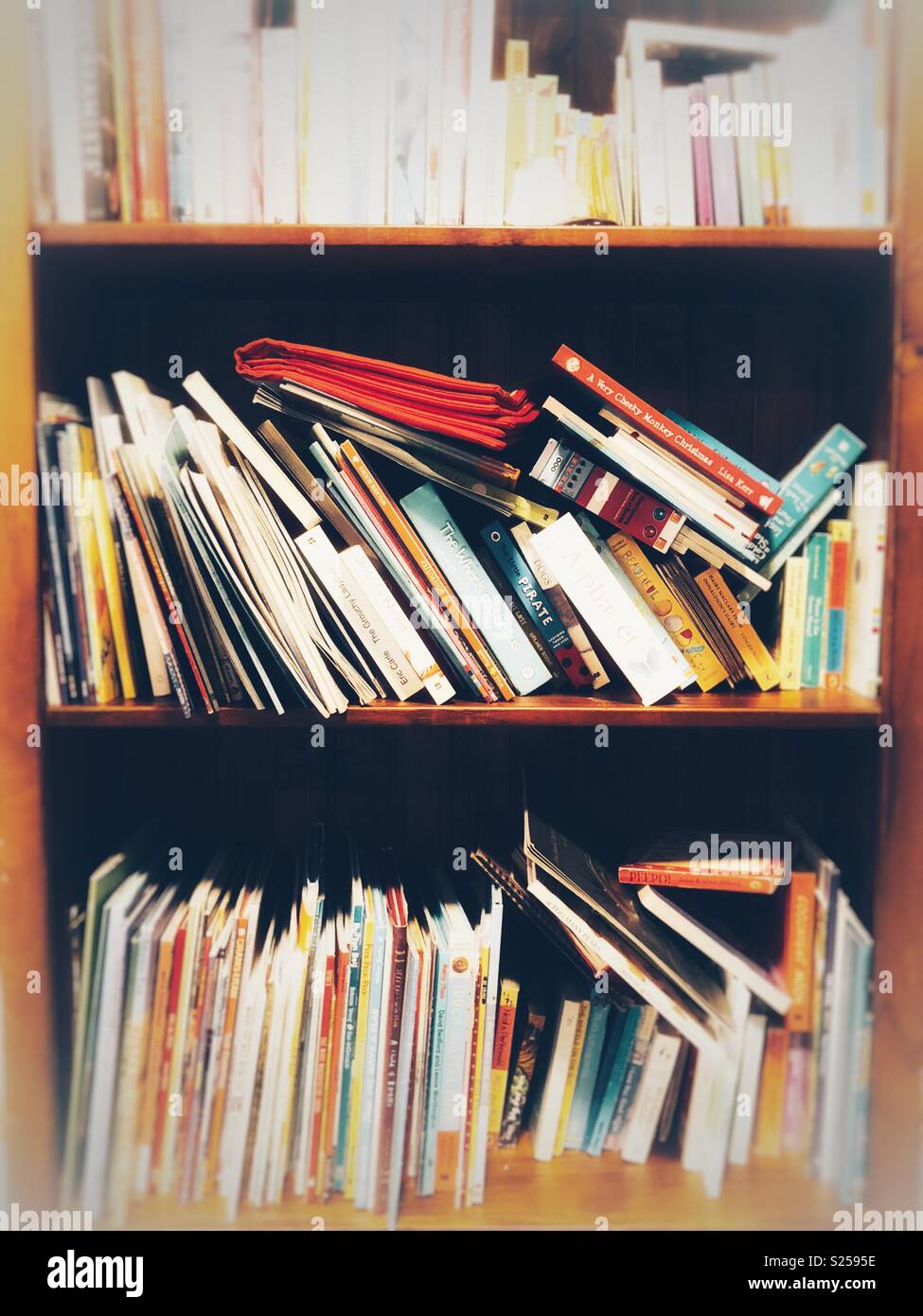 Books on bookshelf Stock Photo