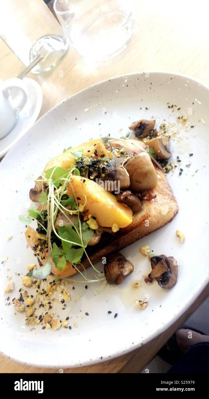 Breakfast cooked peach and mushrooms on toast Stock Photo Alamy