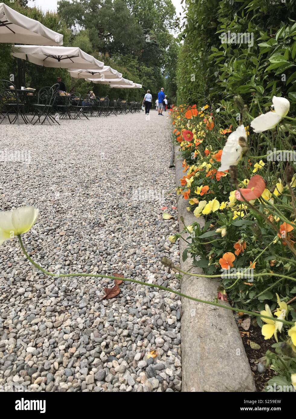People on Isola Bella, one of the Borromean Islands of Italy. - Smartphone Captured Stock Image