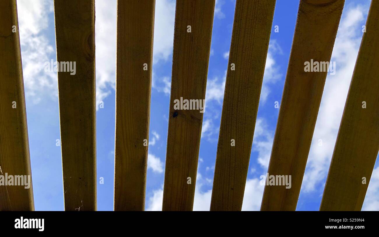 Sky through wood slats Stock Photo