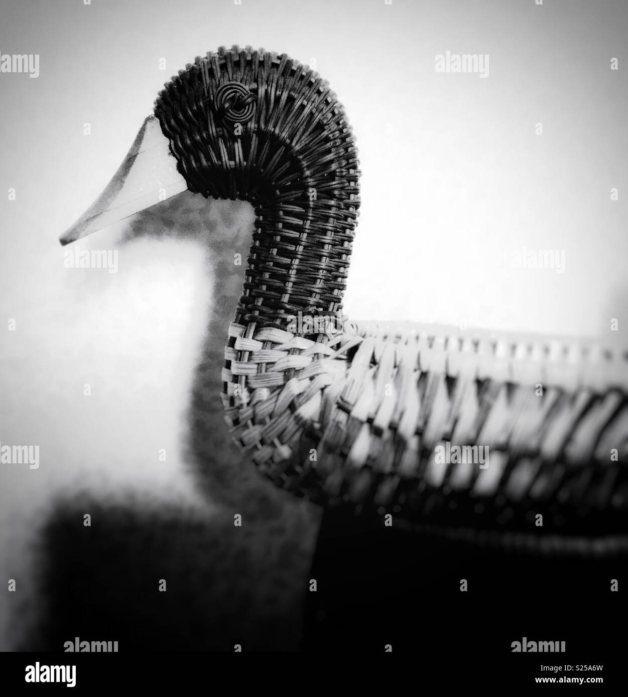 Wicker work basket in the form of a duck in black and white photo - Smartphone Captured Stock Image