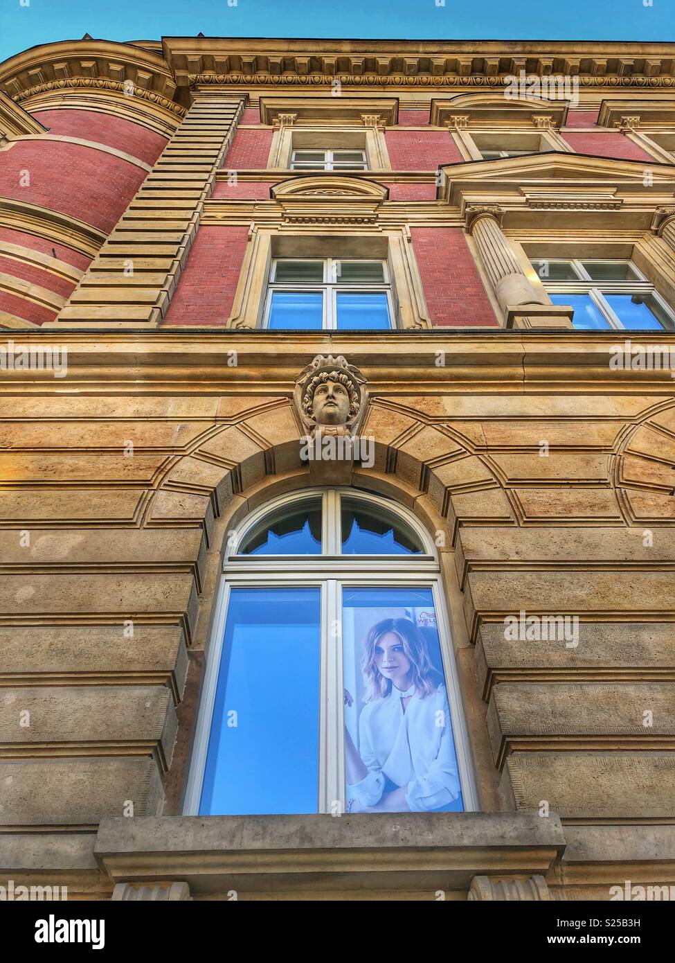Two faces looking down at you. - Smartphone Captured Stock Image