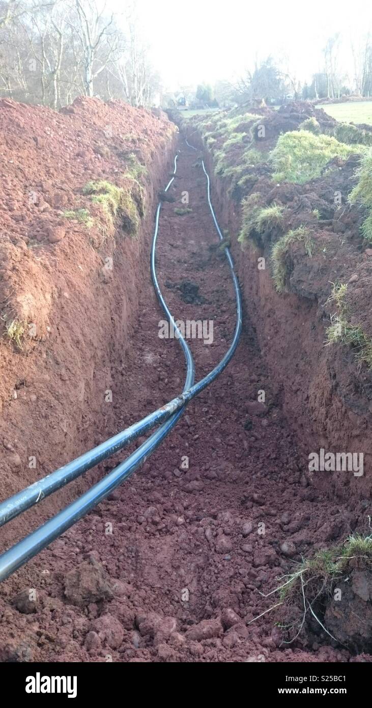 Trench with ground loop in it. Ground Source Heat Pump Installation Stock Photo