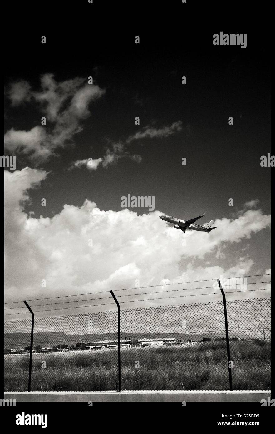 A plane takes off from Reus Airport, Catalonia, Spain. - Smartphone Captured Stock Image