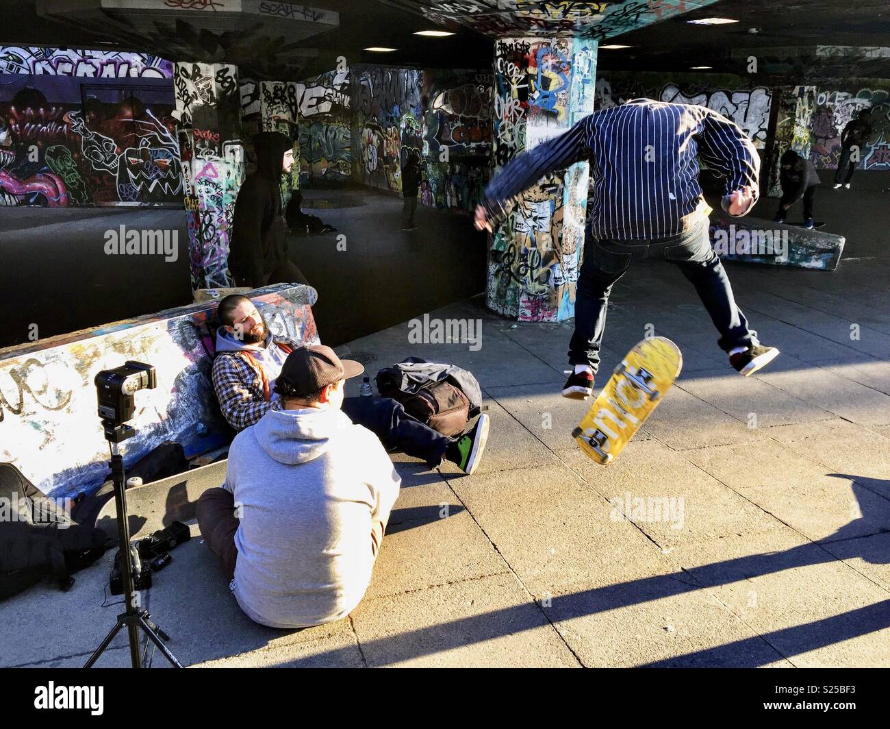 Skateboarder practicing under the Southbank Stock Photo