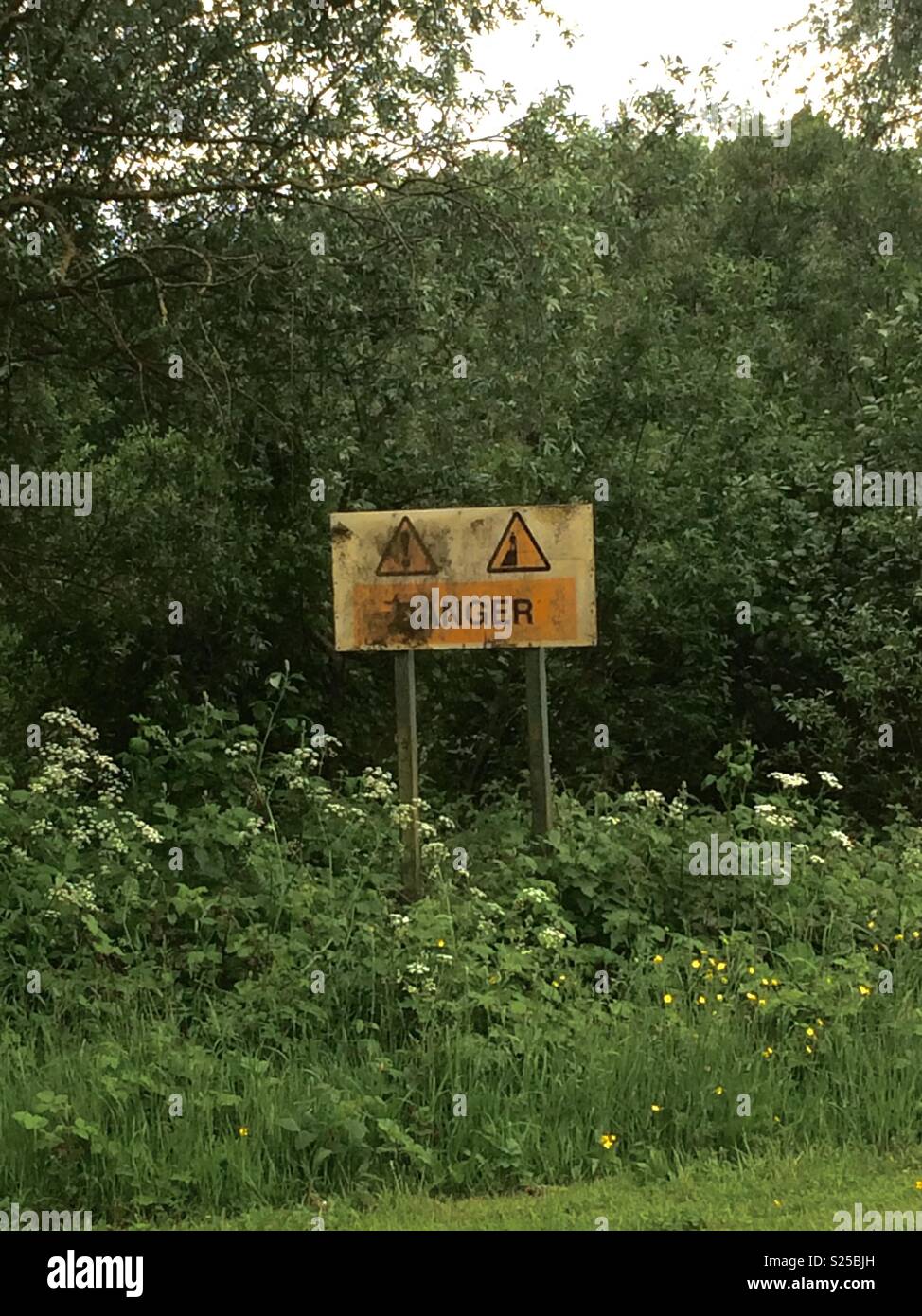 Danger sign. Stadt Moers Park, Whiston, Knowsley, United Kingdom. - Smartphone Captured Stock Image